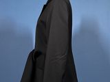 an image of a black suit on a mannequin stand