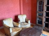 two chairs and a table in a living room