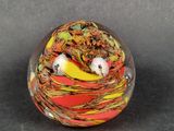 a glass ball that has a bird inside of it