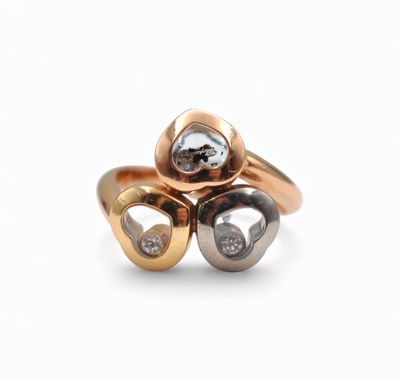 two tone gold and silver rings with diamonds on a white background