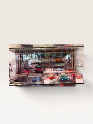 a picture of a display case filled with toy cars