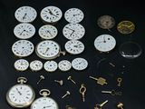 many different types of pocket watches on the table