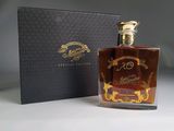 an image of a bottle of liquor in front of a box