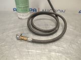 a hose that is sitting on a table next to a spray bottle