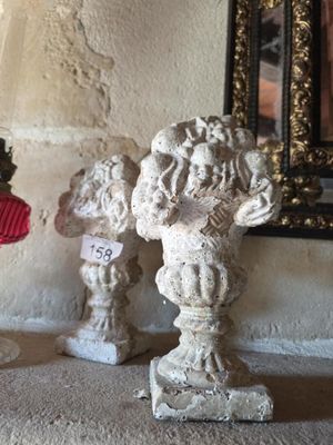 a small statue of a man with a red hat and a teddy bear