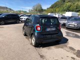 a small car that is parked in a parking lot