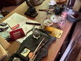 a cluttered desk with a lot of clutter on it
