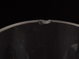 water pouring into a glass on a black background