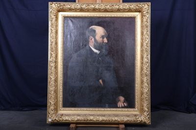 painting of a man with a beard in a gold frame on a blue background