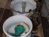 a bird cage with a toilet and a sink in it