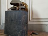 a black box with a lamp on top of it on the floor