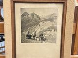 an old picture of a mountain scene in a frame on a shelf