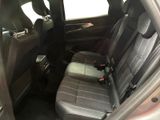 the back seat of a car with a remote control in it