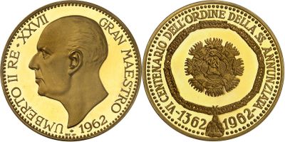 a close up of a gold coin with a man ' s face on it
