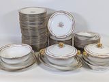a lot of plates and bowls on the table