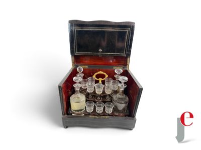 a small wooden box with a lot of glasses inside of it