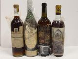 several bottles of liquor are lined up on a table