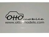 a white business card with a black logo on it