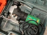 a tool box with a drill and a cord in it