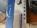 a person holding a box that has a blender in it