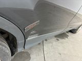 a close up of a car ' s bumper with a sticker on it