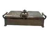 a metal box with two trays sitting on top of it