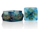 two pieces of blue and green glass with flowers on them