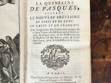 an old book with an image of jesus on the cross