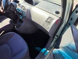 a view of the inside of a car from the driver ' s seat