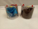 two plastic containers that are sitting on a table