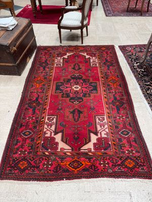 a rug on the floor in the middle of a room