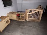 a room with a bed, a desk, and a crib in it