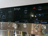 a close up of a coffee machine on a counter
