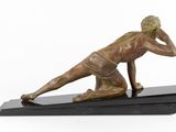 bronze statue of a man on a black base