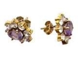 une photo d'une paire de boucles d'oreilles en or et en améthoreate