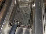a deep fryer in the middle of the kitchen
