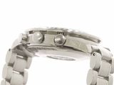 a close up of a watch on a white surface with a white background