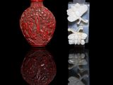two chinese carved glass snuff bottles with flowers on them