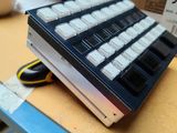 a computer keyboard sitting on top of a cardboard box
