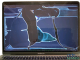 a laptop with a picture of a man and a woman on it