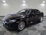 an image of a black sports car in a garage