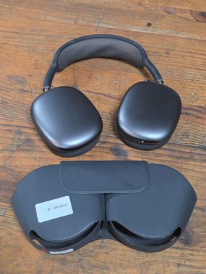 an image of a pair of headphones sitting on top of a wooden floor