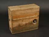 a small wooden box that has a lock on it