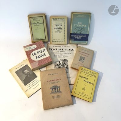 a lot of books that are sitting on a table