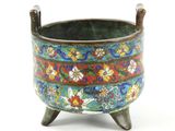 an image of a colorful flowered pot on a stand