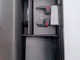 a black box with a keyboard, mouse, and other items in it