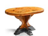une table à manger ovale avec un plateau en bois et des pieds en métal noir