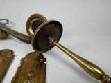 a lot of brass items that are on the table