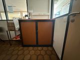 a small cabinet in the corner of a room