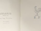 an open book with a picture of a rooster on it